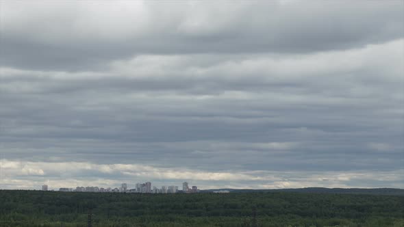 Clouds Moving on Sky Over Town