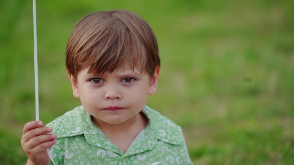 Portrait of adorable small baby boy outdoors