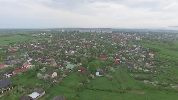 Small Town with Low Houses in Spring Nature. Aerial View