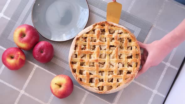 Apple Pice Cake Preparation Series  Woman Taking Slicie of a Traditional Pie  Top View