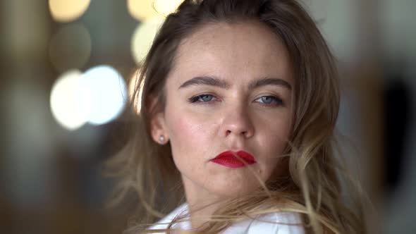 Closeup Portrait of Sexy Caucasian Woman with Long Hair and Red Lips, Looking at Camera