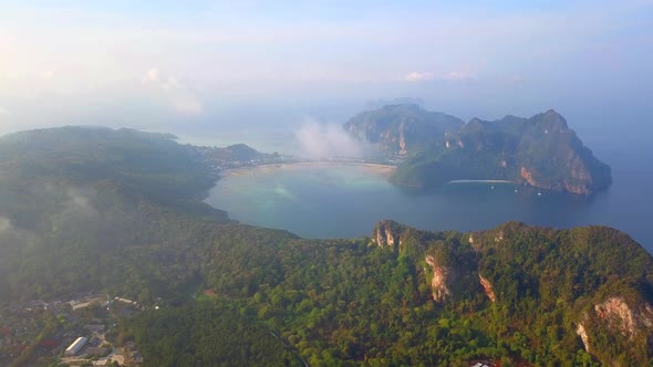 Aerial view of Phi Phi, Maya beach with blue turquoise seawater, mountain hill