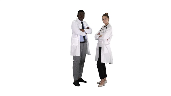 Woman and man doctors with crossed arms on white background.