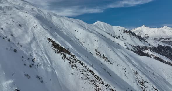 Aerial view of beautiful snowy mountains in Gudauri, Georgia