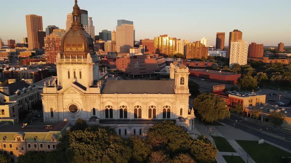 St Marys cathedral during golden hour in minneapolis, mn, downtown in the background