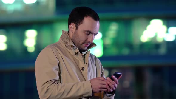 Handsome Adult Man Sending a Text Message While Standing in the City Street, Business Man Reading