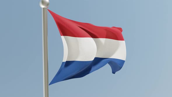 Dutch flag on flagpole.