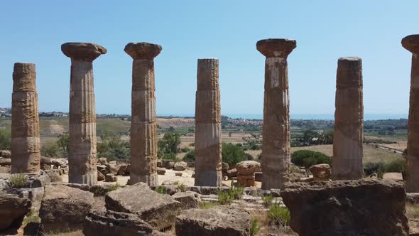 Ancient Roman columns standing tall, ruins from historic empire building, aerial