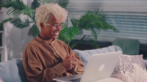 Side View Woman Waving Hand Starting Online Meeting Video Call with Colleagues