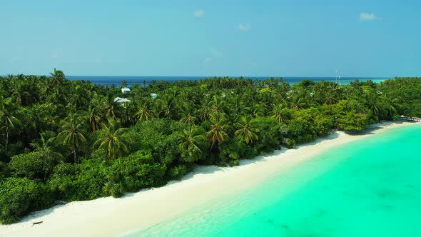 Wide angle above island view of a summer white paradise sand beach and aqua turquoise water backgrou