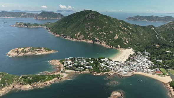 Drone footage of beautiful Shek O village with a beach in Hong Kong