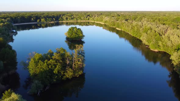 Beautiful landscape, Forest woods and tranquil lake.Calm aerial view flight panorama overview drone