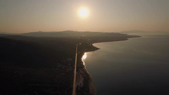 Aerial Scene of Shoreline, Sea and Green Upland at Sunset, Greece