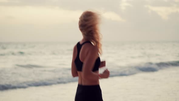 Fitness Woman Runner. Exercising Runner Cardio Jogging. Fit Athlete Jogger Workout At Sunrise.