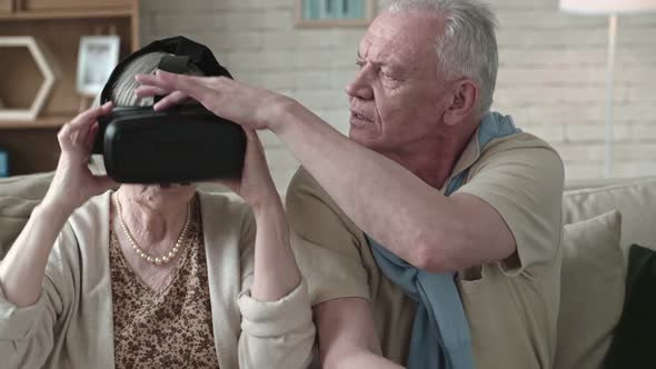 Elderly Couple Trying VR Glasses