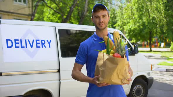 Delivery Company Worker Holding Grocery Bag, Food Order, Supermarket Service