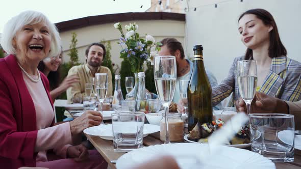 Family and friends having dinner together