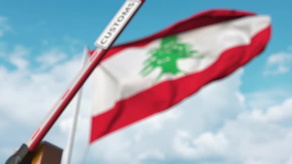 Closing Boom Barrier with CUSTOMS Sign at Flag of Lebanon