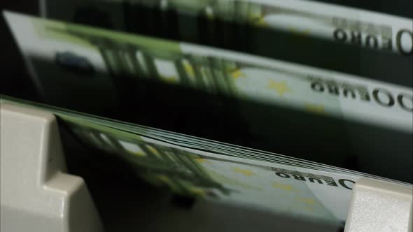 Calculating Machine for Money Counting One Hundred Euro Banknotes Closeup