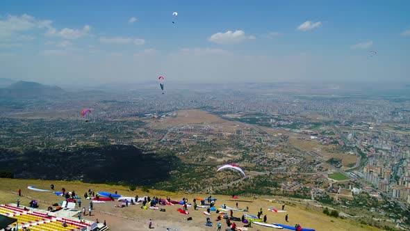 Paragliders In City Landscape