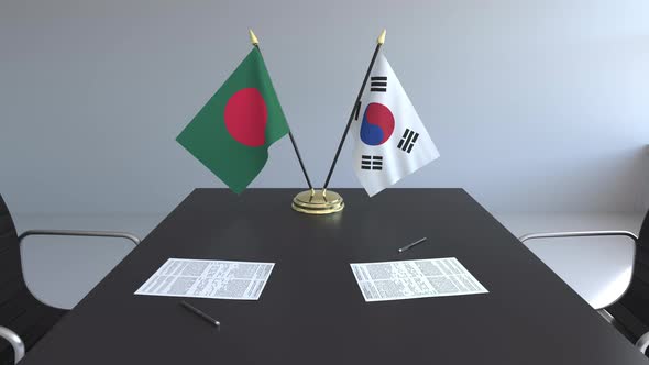 Flags of Bangladesh and South Korea on the Table