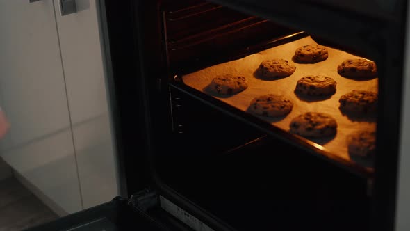 Young Housewife Making Homemade Cookies in Kitchen