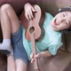 Little asian child boy online learning playing ukulele on armchair at living room - VideoHive Item for Sale