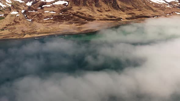 Drone Over Misty Fjord Towards Mountains