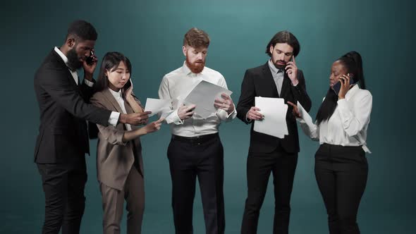 Coworkers are Standing Together Talking on the Phones and Resolving Some Important Questions in Slow