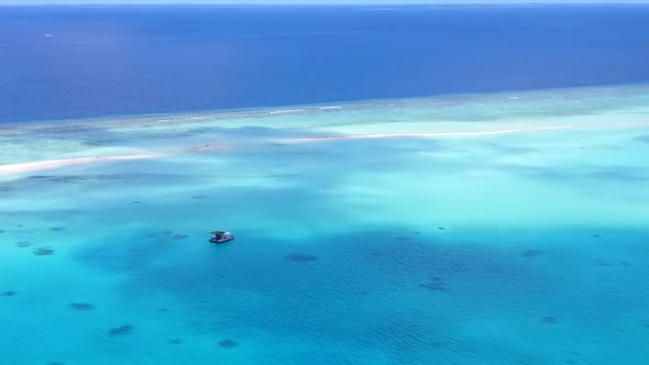 Aerial drone scenery of island beach break by lagoon and sand background