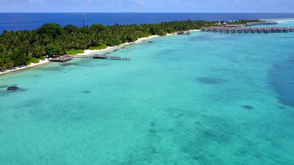 Aerial drone travel of tourist beach by ocean with sand background