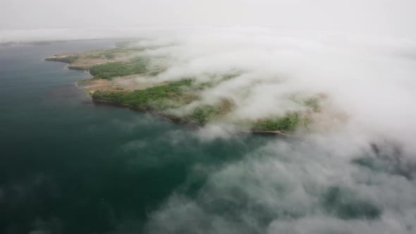 Aerial View of the Green Rocky Coastline and Clear Turquoise Sea in Asia