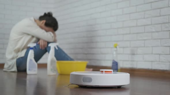 Woman with Robotic Vacuuming.