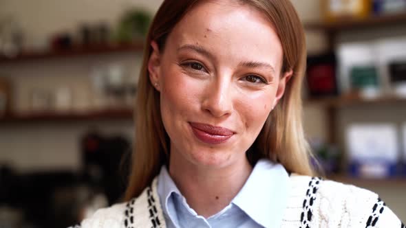 Laughing blonde woman looking at camera