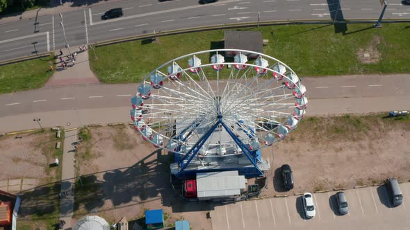 Ferris Wheel Operating at Busy Multi Lane Road