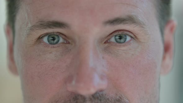 Close Up of Blinking Eyes of Middle Aged Man 