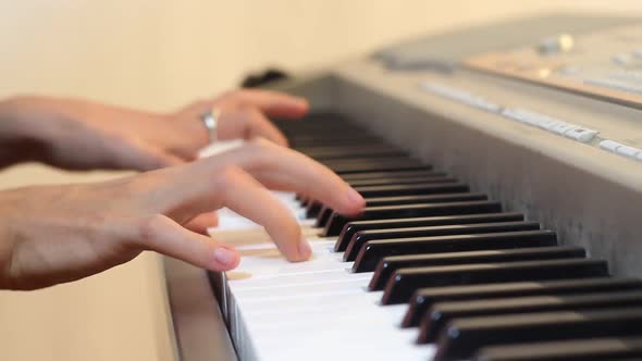 Woman Plays On Electronic Piano