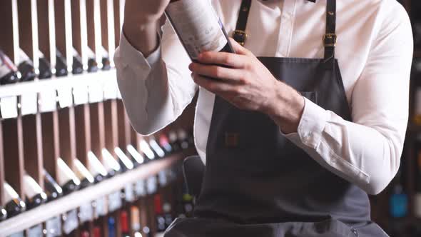 Immersed Alcohol Critic Fixedly Gazing at Wine