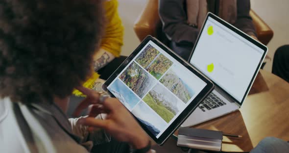 Man Showing Photos and Images on Tablet