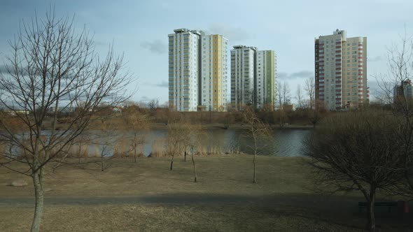 City block near the river. Multi-story houses. Water city system. Aerial photography.