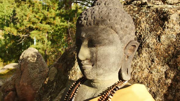 Close-up of a stone Buddha's face at the stupa in Red Feather Lakes, CO