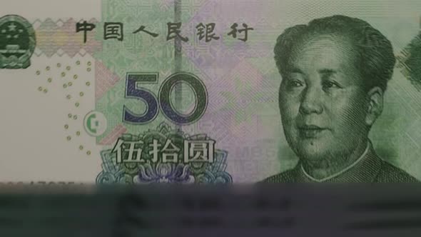 50 Chinese Yuan banknotes in cash machine.