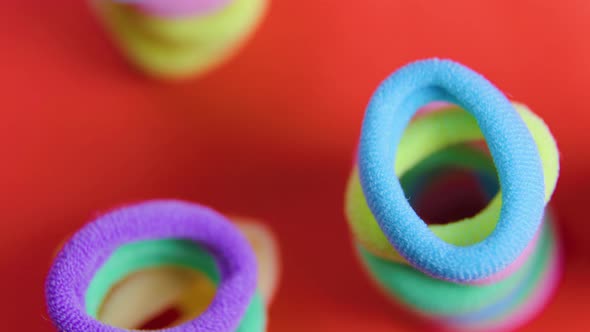 Rubber Bands Close Up Very Colorful Rotating Colors Red Background