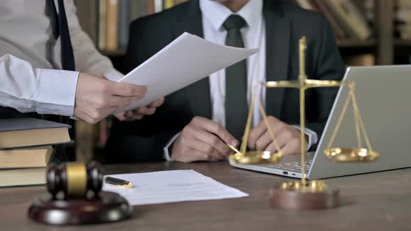 Close Up Shoot of Judge Hand Reading and Signing the Document