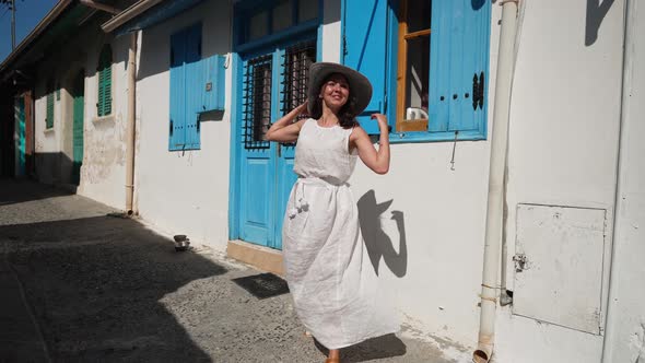 Excited Tourist Strolling Spinning in Slow Motion Walking on Ancient Street in Cyprus Town on Summer