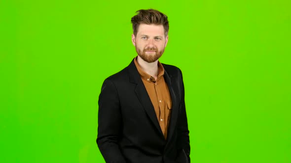 Male Businessman Showing Thumbs Up, He Likes Everything. Green Screen