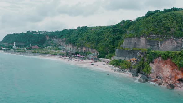 Aerial Shots of a Beautiful Ocean Landscape with Green Trees Rocks a Beach and Clear Azure Water