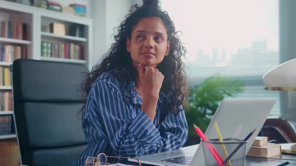 Young Ethnic Indian Woman Unable to Concentrate Working or Studying on Laptop