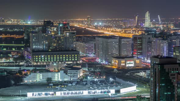 Aerial Skyline of Abu Dhabi City Centre From Above Night Timelapse