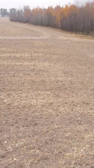 Vertical Video Empty Plowed Field in Autumn Aerial View